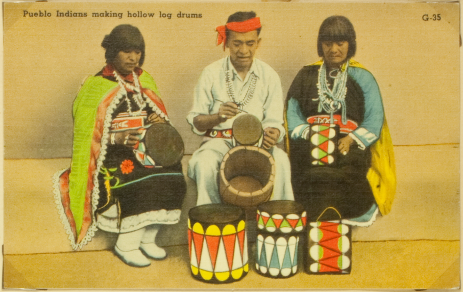 Pueblo Indians making log drums